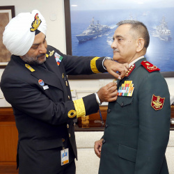 Secretary, Kendriya Sainik Board Commodore HP Singh pinning the Armed Forces Flag on Chief of Defence Staff General Anil Chauhan in New Delhi on December 06, 2022 ahead of Armed Forces Flag Day.