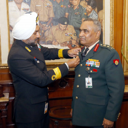  Secretary, Kendriya Sainik Board Commodore HP Singh pinning the Armed Forces Flag on Chief of the Army Staff General Manoj Pande in New Delhi on December 06, 2022 ahead of Armed Forces Flag Day.